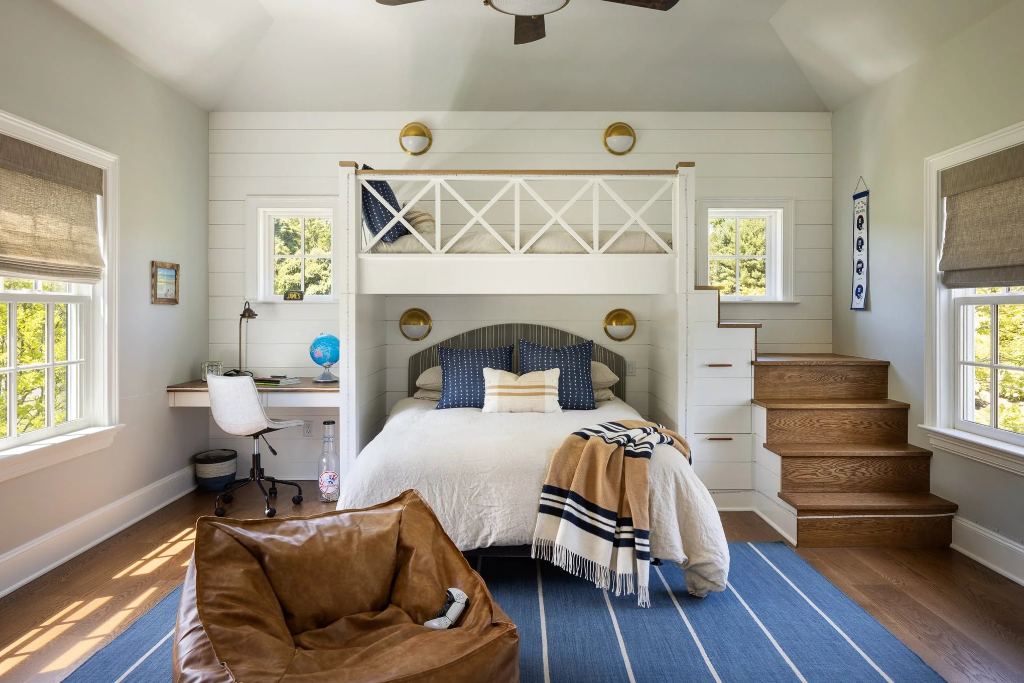 Children’s bedroom with custom bunk beds, desk, and striped blue rug — Moonlight project.